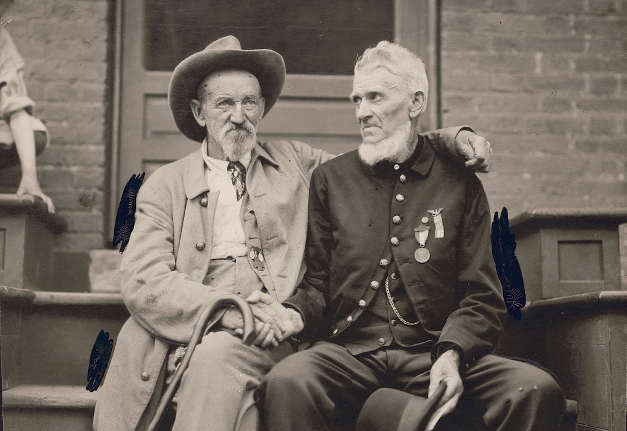 This photo, titled “All Enmity Forgotten,” shows unidentified Union and Confederate veterans shaking hands at the 1913 reunion of the Battle of Gettysburg.