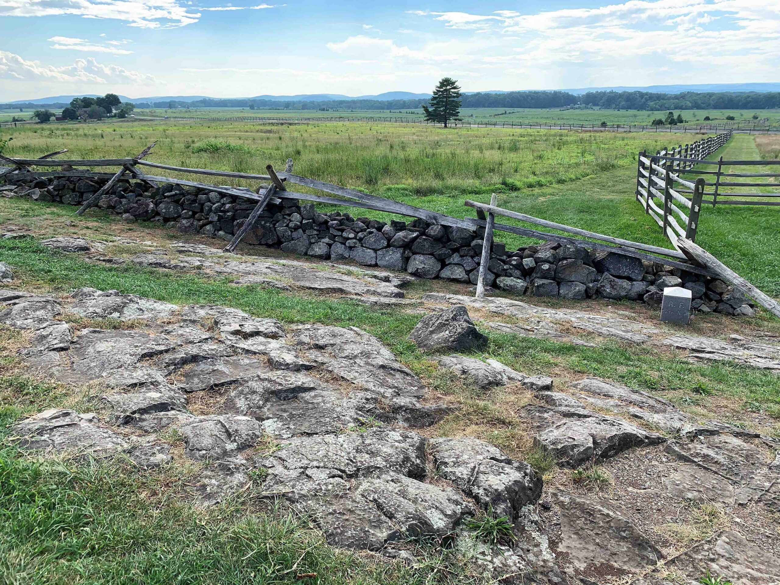 Diabase, a durable igneous rock, still shows on the Brian Farm at Gettysburg. James Longstreet’s attack on July 3, 1863, proceeded across this field toward the stone wall in the foreground. The reason the men of the 12th New Jersey Infantry didn’t dig entrenchments here is plain to see.